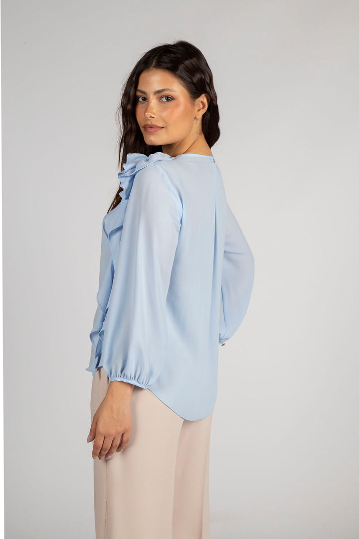 BLUSA AZUL CLARO COM FLOR SILVINA CAMPOS