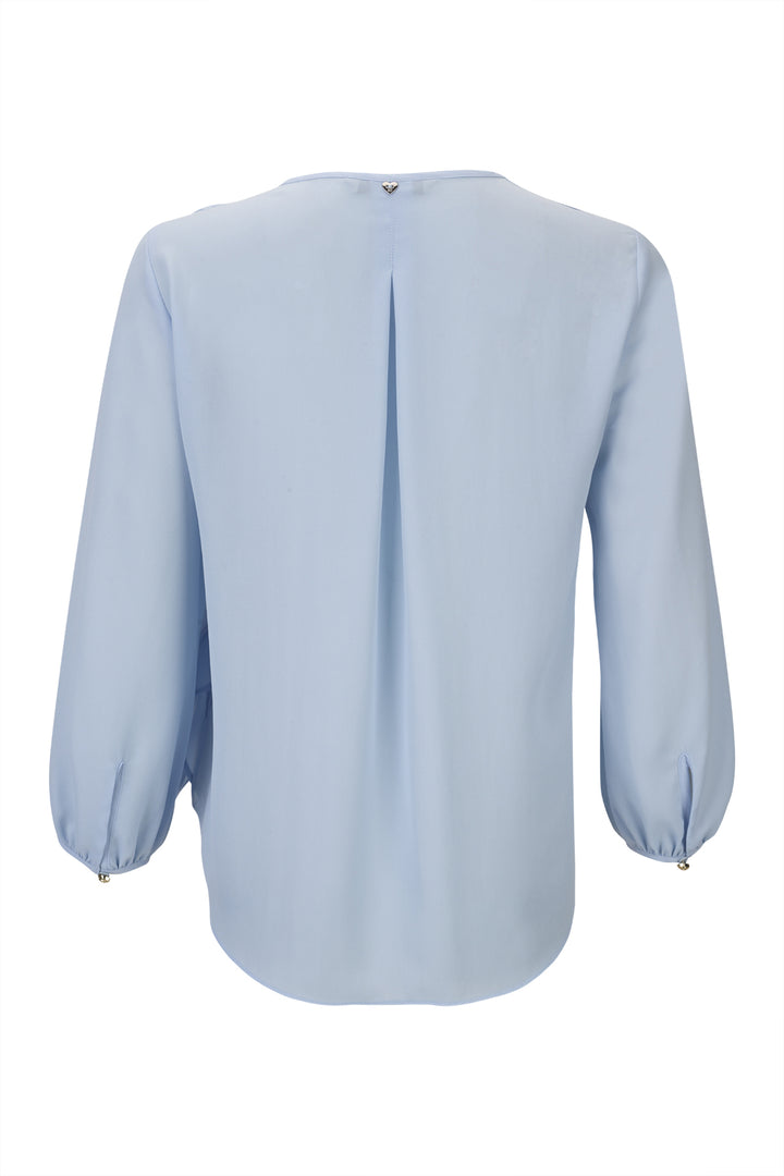 BLUSA AZUL CLARO COM FLOR SILVINA CAMPOS