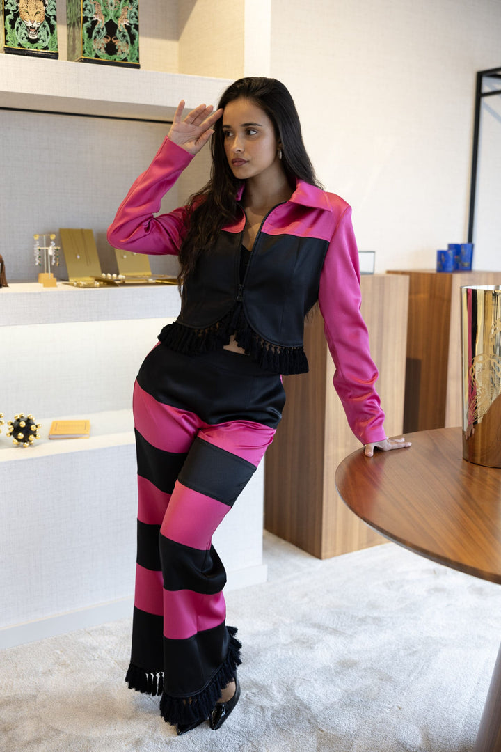 CALÇA BICOLOR PRETO E FUCSIA COM PADRÃO ONDULADO LOCOLUXO