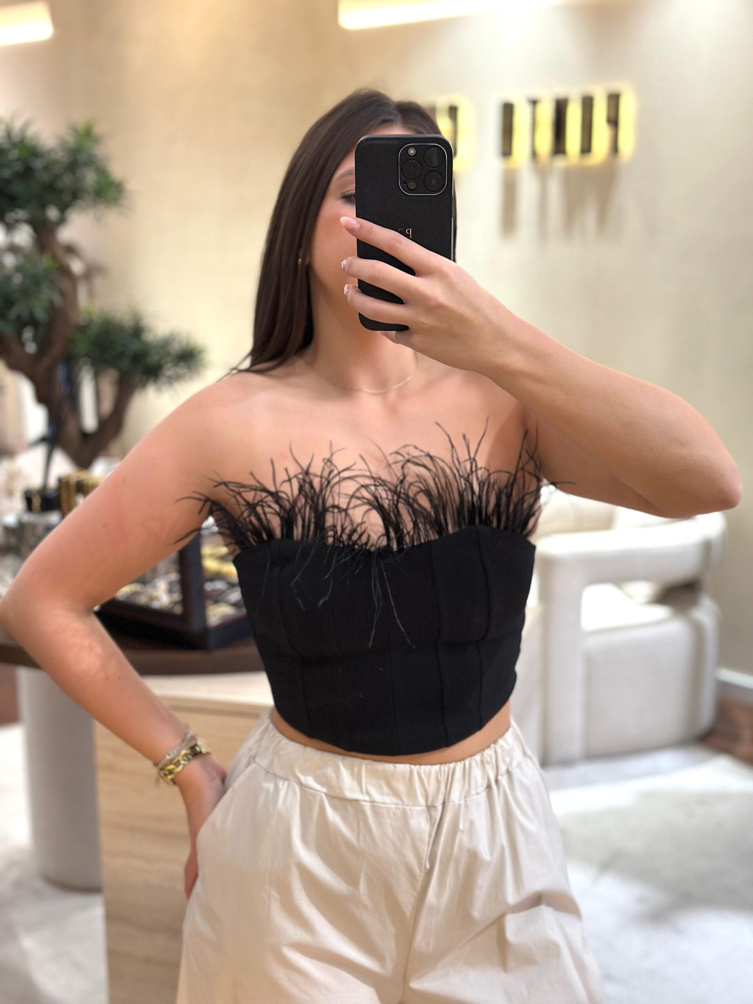 TOP COM PLUMAS NO TOPO DIXIE