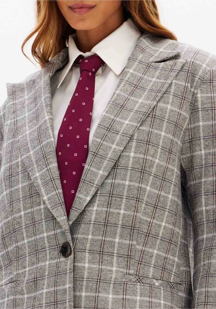 BLAZER CINZA AOS QUADRADOS LANÇA PERFUME