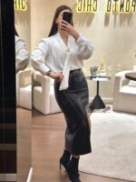 SAIA MIDI PRETA EFEITO PELE COM RACHA NA FRENTE PONTO CHIC